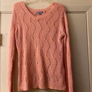 A pink sweater